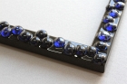 Blue glass stones, black frame resin detail