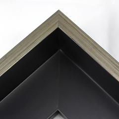 This Large, L-shaped floating contemporary canvas frame in matte black features a thin brushed silver face.

*Note: These solid wood, custom canvas floaters are for stretched canvas prints and paintings, and raised wood panels.