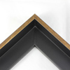 This L-shaped modern canvas floater frame, features a smooth curved wall, and a brushed gold face. 

*Note: These solid wood, custom canvas floaters are for stretched canvas prints and paintings, and raised wood panels.